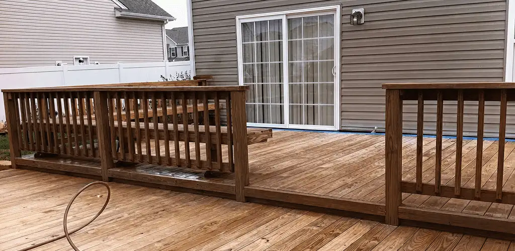 Deck sealing service protecting a backyard wood deck and railings in El Paso, TX
