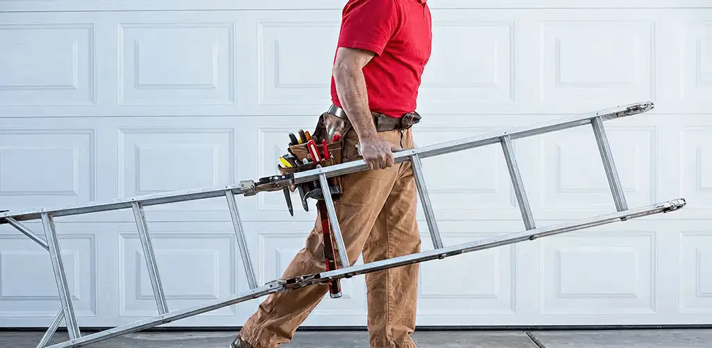 Garage door repair technician arriving with tools and ladder in El Paso, TX
